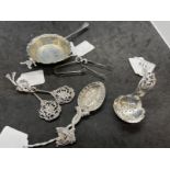 Hallmarked Silver: Tea strainer, two caddy spoons, two pairs of sugar nips, two white metal spoons