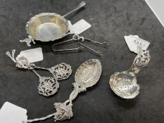 Hallmarked Silver: Tea strainer, two caddy spoons, two pairs of sugar nips, two white metal spoons
