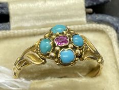 Jewellery: Yellow metal ring set with a single ruby and four turquoise as a floral cluster, tests as