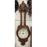 Edwardian oak cased aneroid barometer, mercury thermometer, unsigned. 36ins. x 12ins.