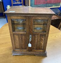 Early 20th cent. Oak smokers/collectors cabinet. 17ins. x 14ins. x 8½ins.