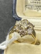 Jewellery: Yellow metal ring set with seven brilliant cut champagne colour diamonds, estimated