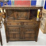 20th cent. Oak Jacobean style court cupboard the top with carved frieze and two turned columns, a