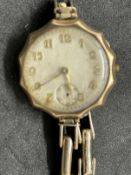 Watches: Yellow metal ladies wristwatch, round dial with Arabic numerals attached to a yellow