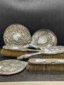 Hallmarked Silver: Silver backed hand mirrors x 3, silver backed hairbrushes x 3. (6)