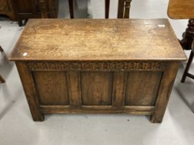20th cent. Oak Jacobean coffer hinged lid, carved frieze above a three panel front on stile feet.