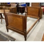 Late 19th/early 20th cent. Mahogany bed with square moulded panels flanked by turned columns, slight