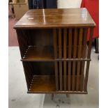 Edwardian revolving bookcase with slat work sides. 32ins. x 21ins.