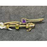 Jewellery: Yellow metal two bar brooches, one set with amethyst, the other with peridot, both test