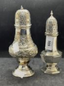 Hallmarked Silver: Sugar sifters one octagonal shaped and one bulbous with scroll decoration. One