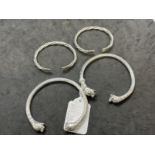 Jewellery: White metal tests as silver Etrusan style bangles with dog heads and a pair of child's