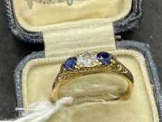 Jewellery: Yellow metal three stone ring set with a single brilliant cut diamond, estimated weight