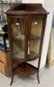 Edwardian bow front corner display cabinet. The top with a gallery, the 2 doors with checkered inlay