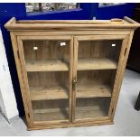 Late 19th cent. pine glazed door cupboard moulded cornice above 2 glazed doors & 2 fitted shelves.