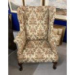 19th cent. Paisley upholstered high wing back chair, front pad feet sloping rear supports. Height