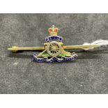 Hallmarked Jewellery: 9ct gold and enamelled Royal Artillery brooch. Weight 4.5g.