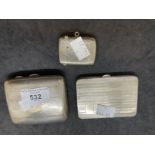Hallmarked Silver: Two cigarette cases and one Vesta case. Total weight 6.8oz.
