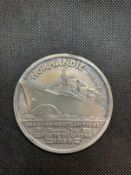 OCEAN LINER/ART DECO: Rare S.S. Normandie silver medallion decorated with the great liner and