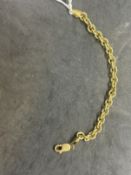 Jewellery: Yellow metal curb link bracelet, tests as 18ct gold. Length 7ins. Weight 15.3g.