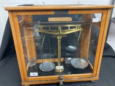 Scientific Instruments: 19th cent. Laboratory scales in glazed beech cabinet, with weights,