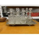 Glass: Three ring glass decanters x 2, two square and four others plus a spare stopper and a diamond