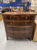 19th cent. Mahogany bow front chest of drawers on bracket feet with shaped front apron, turned