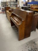 20th cent. Piano by Bentley, iron frame over strung in a rosewood and walnut case. Approx. 45ins.