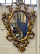 20th cent. Gilt framed mirror, organic carved frame.