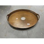 Oak oval twin handled tray with silver plated gallery. 20ins. x 14½ins. Plus an oak oval folding
