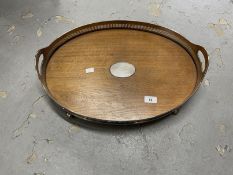 Oak oval twin handled tray with silver plated gallery. 20ins. x 14½ins. Plus an oak oval folding