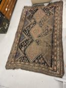 Carpets & Rugs: Early 19th cent. Handmade Kazak rug, black ground, six borders and a central panel