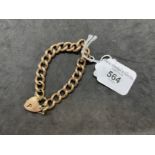 Hallmarked Jewellery: 9ct gold curb link bracelet with padlock fastener. Length 7ins. Weight 16.3g.