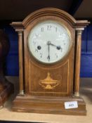 Clocks: Edwardian mahogany mantel clock arched top, columns to the sides with an inlaid urn to the