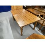 20th cent. Pine dining table, modern on turned legs. Approx. 60ins. x 36ins.