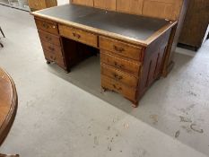 Edwardian mahogany stained nine drawer twin pedestal desk with brass drop handles. Approx. 66ins.