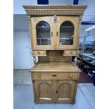 19th cent. Continental pine glazed top dresser with two glazed doors above two small drawers, the