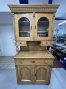 19th cent. Continental pine glazed top dresser with two glazed doors above two small drawers, the