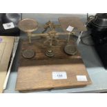 Scientific Instruments: 20th cent. Brass postal scales and a hanging balance. (2)