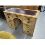 19th cent. Pine nine drawer knee hole desk with brass handles. 48½ins. x 23ins. x 33ins.