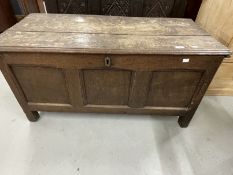 Late 18th cent. Oak coffer the two plank top with moulded edge to the front. The front with three