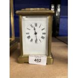 Clocks: French brass carriage clock, white enamel face, Roman numerals. 4½ins.