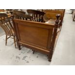 Late 19th/early 20th cent. Mahogany bed with square moulded panels flanked by turned columns, slight