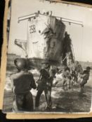Militaria: WWII photographs, thirty 15ins. x 12ins. photographs depicting scenes of Allied troops