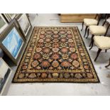 Carpets & Rugs: Oriental woollen carpet black and navy blue ground, two borders and central panel of