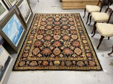 Carpets & Rugs: Oriental woollen carpet black and navy blue ground, two borders and central panel of