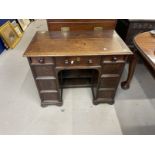19th cent. Oak kneehole desk, three drawers across the top, with a door either side revealing