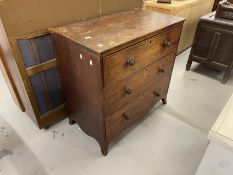 19th cent. Mahogany chest of three long drawers on splayed bracket feet, with brass lion head