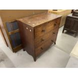 19th cent. Mahogany chest of three long drawers on splayed bracket feet, with brass lion head
