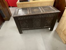 Early 18th cent. Carved oak coffer with hinged rectangular lid, three panel front with diamond