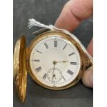 Watches: Yellow metal marked and tested 18ct gold Hunter, white enamel dial, second hand, Roman